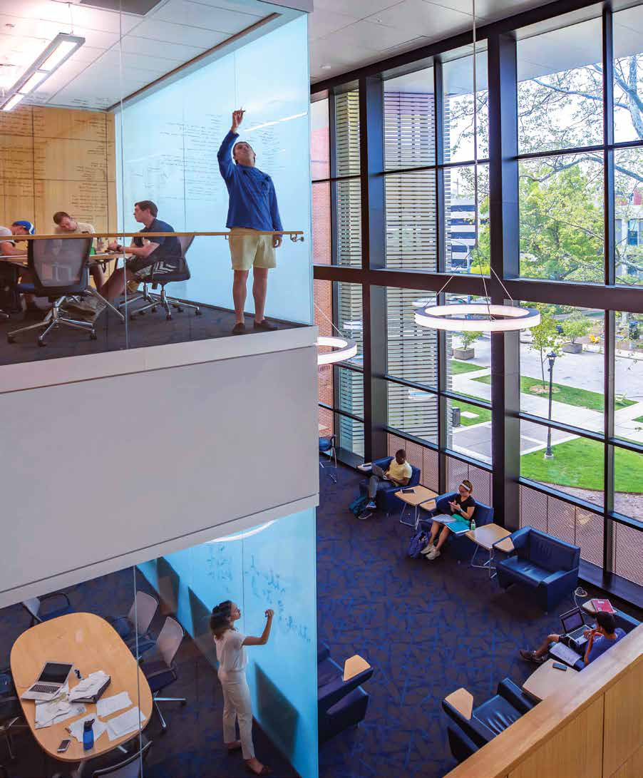 Students learning in the light-filled University of Kentucky science building, photographed by Russell Cross
